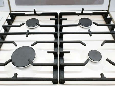 A White gas stove with grill closeupの写真素材