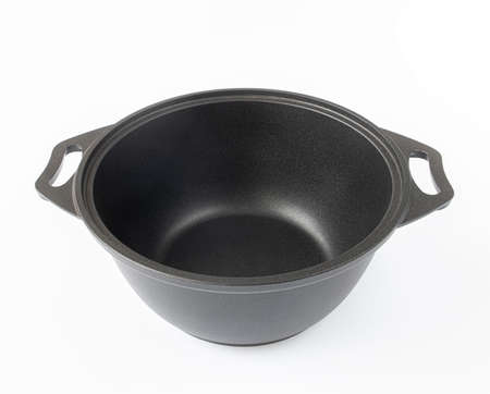 Black cast iron pan on the light backgroundの写真素材