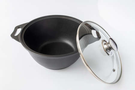 Black cast iron pan on the light backgroundの写真素材