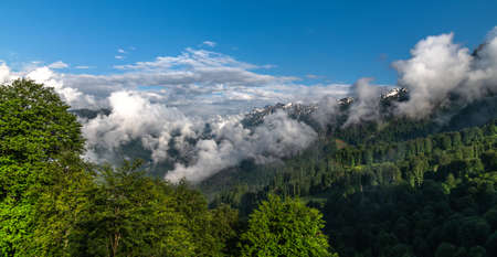 Panorama of the Caucasus mountains with clouds, Russiaの写真素材