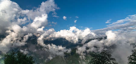 Panorama of the Caucasus mountains with clouds, Russiaの写真素材