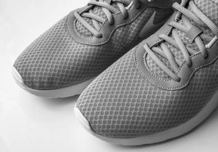 Moscow, Russia - Apr 6. 2019. Gray textile Nike sneakers on a white backgroundのeditorial素材