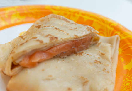 Pancake with salmon on a patterned plate. Pancake week food conceptの写真素材