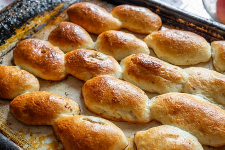 Baked homemade pies on the baking sheetの写真素材