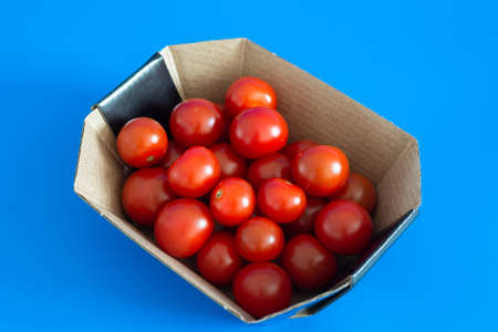 Ripe cherry tomatoes in the cardboard boxの写真素材