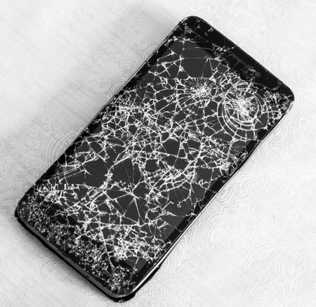 The Smartphone with the broken glass screenの写真素材