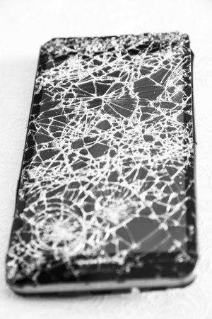 The Smartphone with the broken glass screenの写真素材