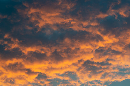 Beautiful sky landscape with yellow clouds at sunsetの写真素材