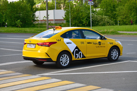 Moscow, Russia - June 1. 2021. Yandex Go taxi company car on roadのeditorial素材