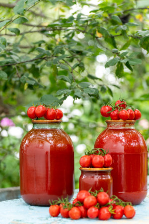 Homemade tomato juice and a fresh tomatoesの写真素材