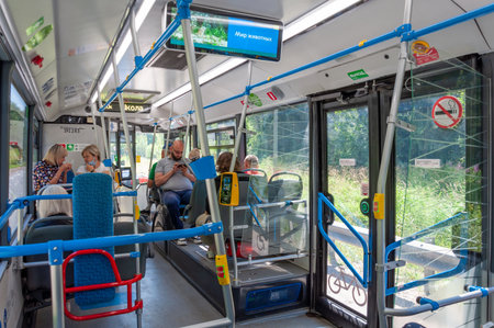 Moscow, Russia - July 22. 2021. Modern bus interior with contactless payment terminal and a monitorのeditorial素材