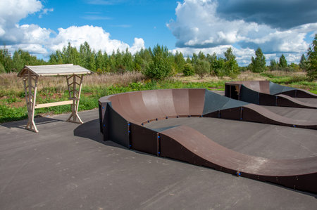 pump track for extreme riding on bicycles, scooters, skateboards and rollerblades.の写真素材