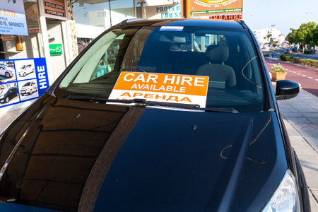Protaras, Cyprus - Oct 6. 2019. Car hire available - sign with the inscription on the glass of the carのeditorial素材