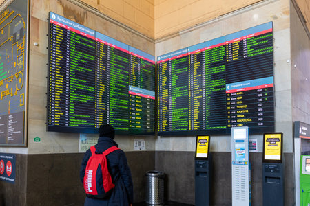 Moscow, Russia - Feb 20. 20201. A teenager with a backpack looks at the schedule at the Kazansky railway stationのeditorial素材