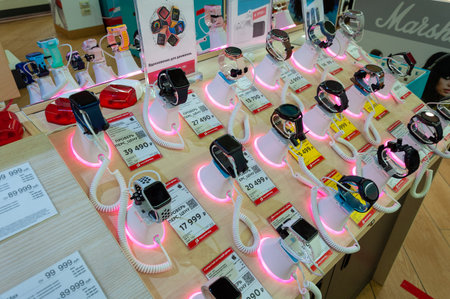 Moscow, Russia - Okt 15. 2021. Smart watches of a various manufacturers on Mvideo shop windowMvideoのeditorial素材