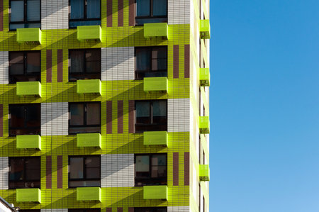 Facade of a modern multi-storey residential building with air conditioner basketsの写真素材