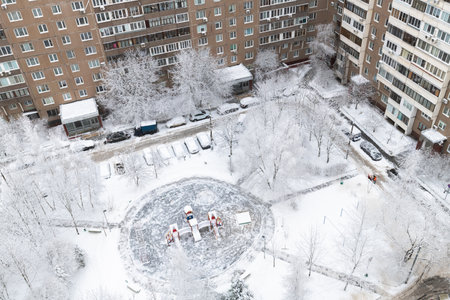 Yard with playground during heavy snow in Russia. Top viewの写真素材