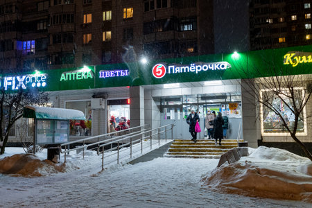 Moscow, Russia - 26 Dec. 2021. Winter cityscape with a shop windows in Zelenogradのeditorial素材