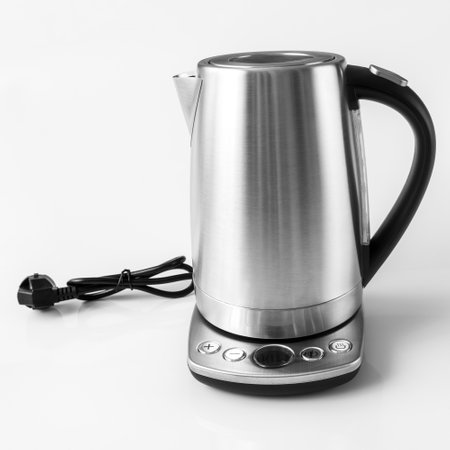 Metal electric kettle isolated on white backgroundの写真素材