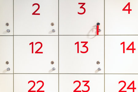 Fragment of a cabinet with numbered storage drawersの写真素材