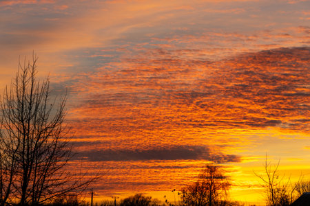 Beautiful sky landscape with yellow clouds at a sunsetの写真素材