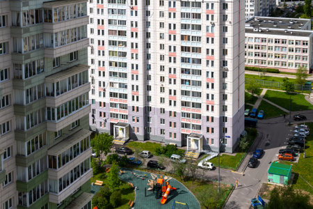Moscow, Russia - May 29. 2022. Ordinary city yard with cars on a topのeditorial素材