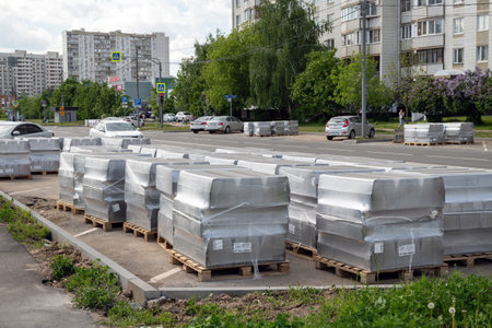 Moscow, Russia - June 4. 2022. Gray curb stone in stack. Preparing to repair the roadのeditorial素材