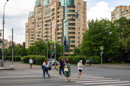 Moscow, Russia - June 14. 2022. People crossing the road at a pedestrian crossing on Central Avenue in Zelenogradのeditorial素材