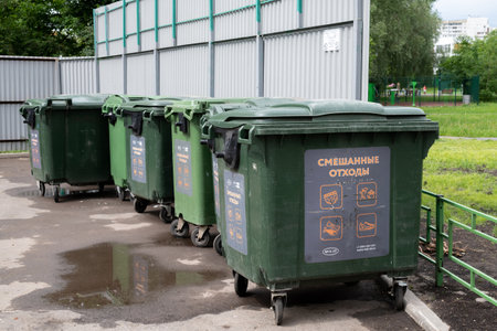 Moscow, Russia - June 17. 2022. Row of a plastic containers for mixed wasteのeditorial素材