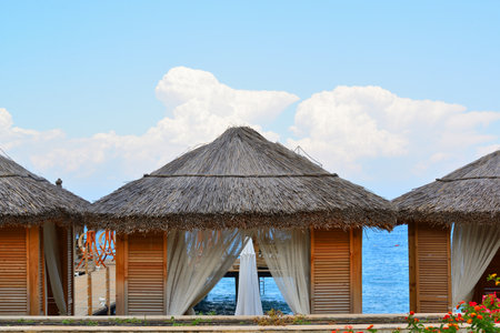 Empty gazebos for relaxing on the beach in Tの写真素材