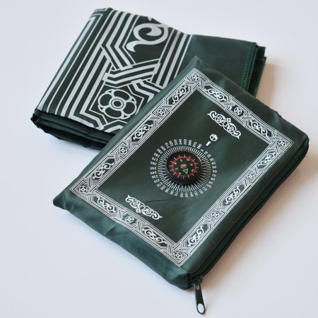 Portable Islamic Prayer Mat with Compass to Point to Meccaの写真素材