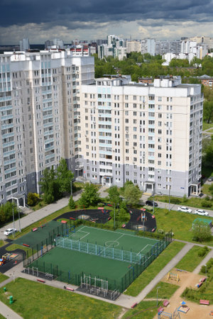 Moscow, Russia -May 29. 2022. Football and volleyball courts near multi-storey residential buildingの写真素材