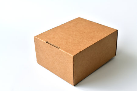 Closed cardboard box isolated on a white backgroundの写真素材