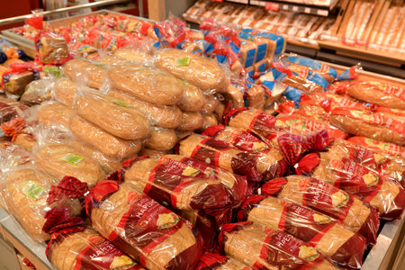 Moscow, Russia - July 10. 2023. Various breads in packaging on the counter in Cash and Carry shopの写真素材