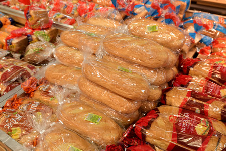 Moscow, Russia - July 10. 2023. Various breads in packaging on the counter in shop