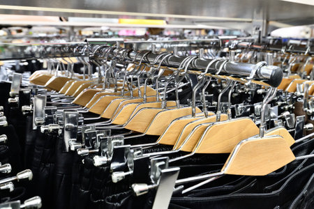 Black leather trousers on hanger in a store