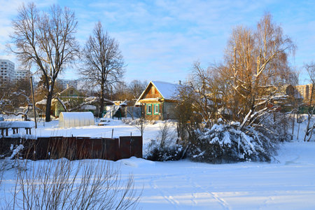 winter landscape with the rural and urban houses, Russiaの写真素材