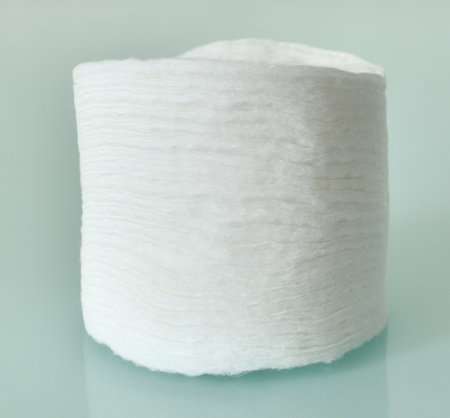 Stack of Cotton disks on a light blue backgroundの写真素材