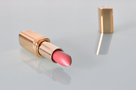 Pink pearlescent lipstick on the light backgroundの写真素材