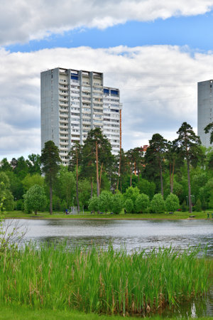 Multi-storey residential buildings on the shore of Shkolnoye Lake in Zelenograd in Moscow, Russiaの写真素材