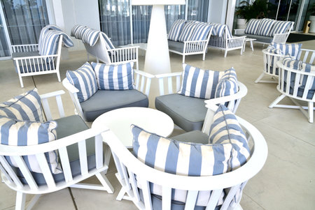 lounge with striped sofas and tablesの写真素材