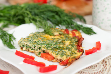 Omelette with sweet pepper and dillの写真素材