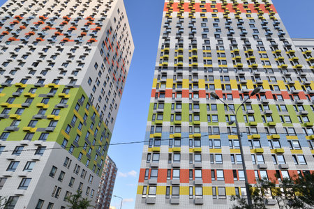 Modern new residential building with air conditioner baskets on the facades, Russia