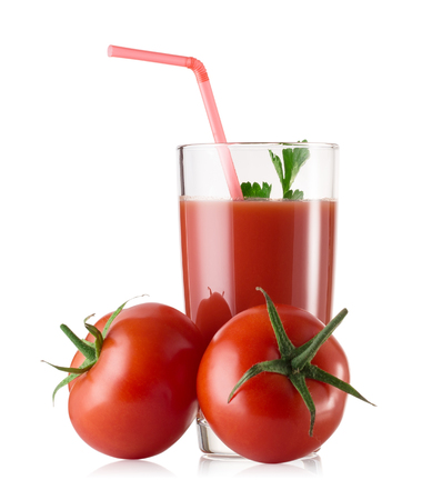 A glass of fresh tomato juice with tomatoes isolated on a white backgroundの写真素材