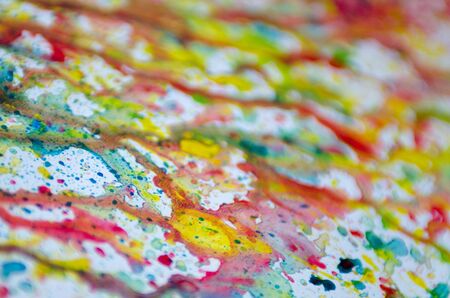Abstract art of vivid bright colorful watercolor splash and drops on the white paper. Whimsical childish technique for creativity and inspiration for kids and adults.の写真素材