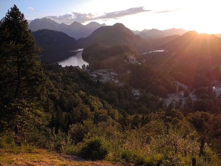 Landscape photo of beautiful german land nature. Trees, lakes, meadows, fields from bird's-eye flight view. Scenic tourist route on the Alpine mountain. Mood of freedom, serenity, relaxation, journey.の写真素材