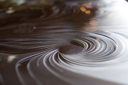 Hi-tech minimalistic abstract flourish plastic image. Planetary moving space concept. Milky way and black holes associations. Blurry empty area for text, copy space. Futuristic cosmic decorative art.の写真素材