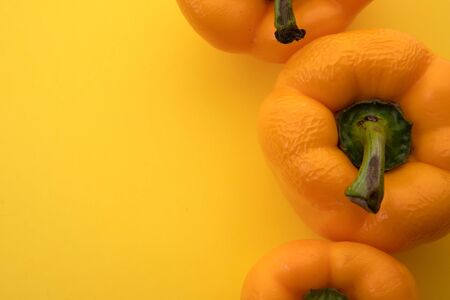 Old pepper, spoiled food. On a yellow background. The passage of time, passing away. I'm not wasting.の写真素材