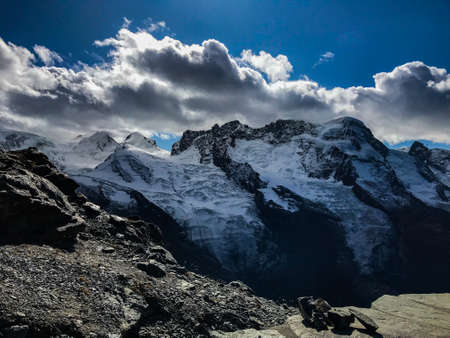 Sunny day with blue sky in the mountains of Switzerland with fantastic views of the Gorner glacier. Location of the Swiss Alps. The most famous tourist destination.の写真素材
