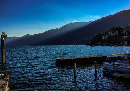 Magnificent view of the lake at sunset with the rays of the setting sun. Location-Ascona, Switzerlandの写真素材